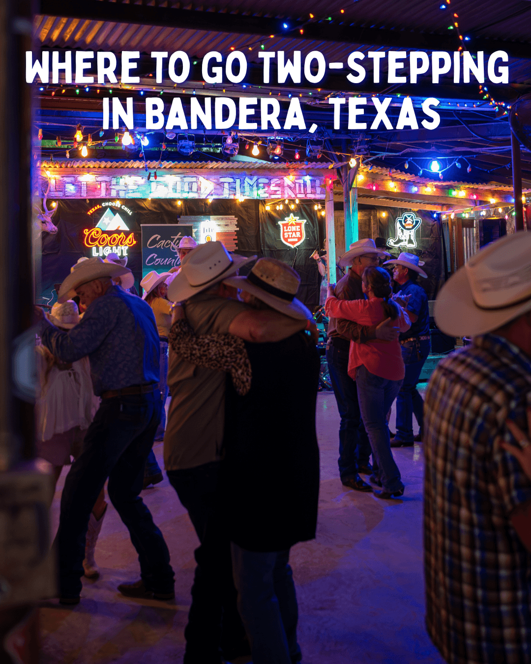 Couples two-stepping in a neon-lit honky-tonk. White caps overlay: “Where to go two-stepping in Bandera, Texas.”